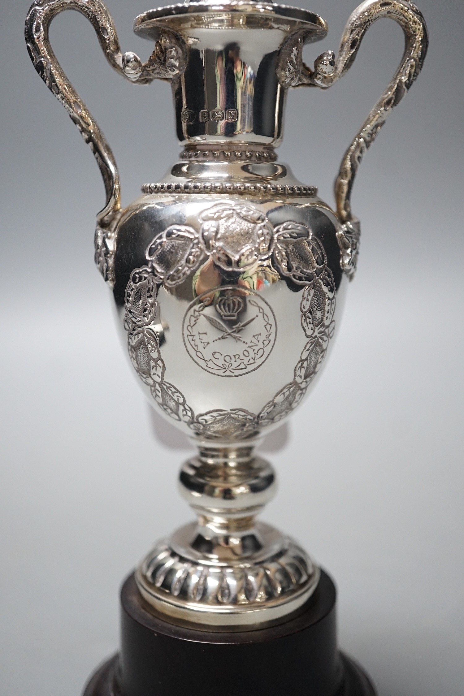 A George VI silver two handled golfing related presentation trophy cup and cover, Alexander Clark Co. Ltd, Birmingham, 1937, 18.3cm, 4.9oz, on wooden socle.